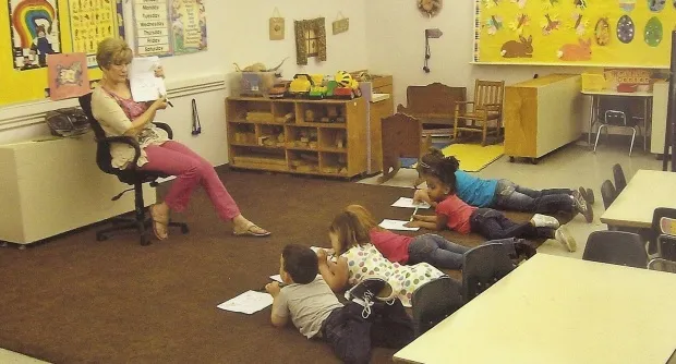 Children listening to the teacher