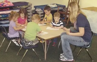 Children at table learning